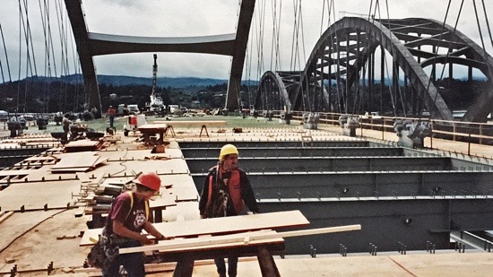 Workers preparing a bridge deck for concrete pouring