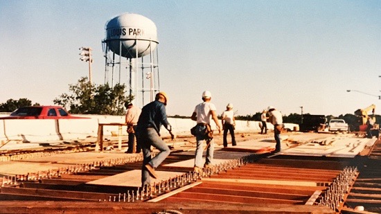 Workers ready to install plywood base for concrete